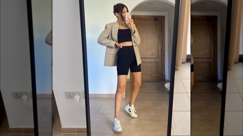 Girl wearing a blazer with a set.