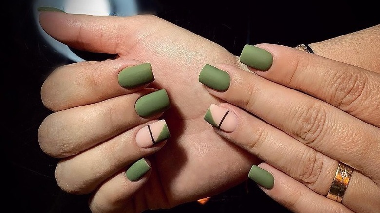 close up of green matte nails