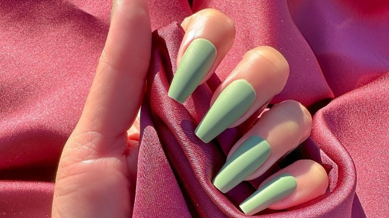 closeup of green pastel manicure