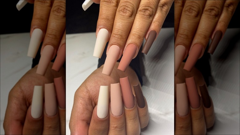 Woman with multiple nail colors