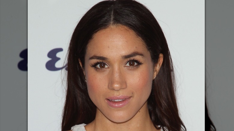 Meghan Markle wearing smudged smoky eyes.