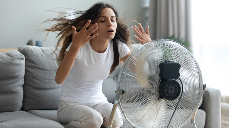 woman in front of fan