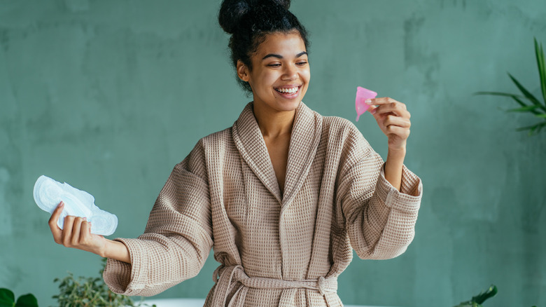 woman in bathroom menstrual cup