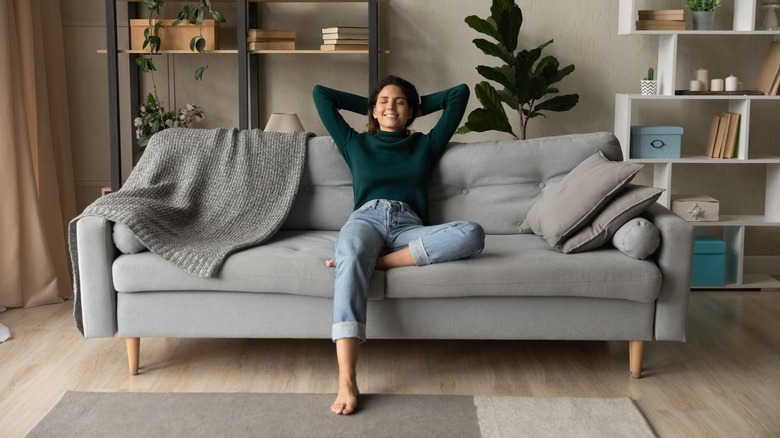 woman relaxing on couch