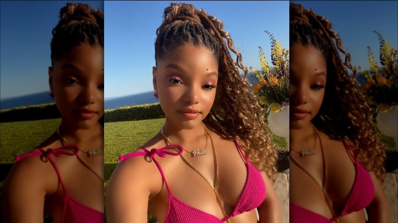 Halle Bailey with wavy hair, pink bikini