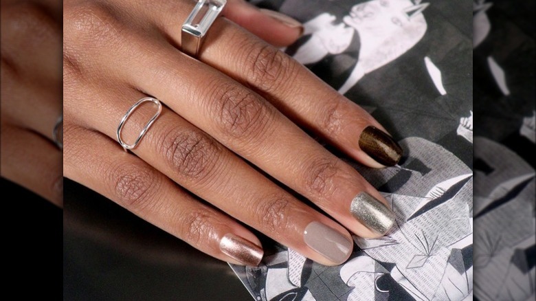 Person with metallic manicure