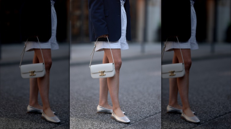 woman wearing silver ballet flats