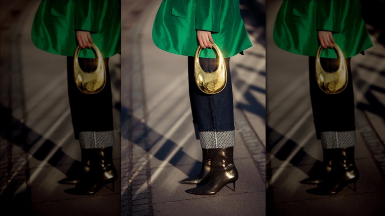 woman wearing bronze boots