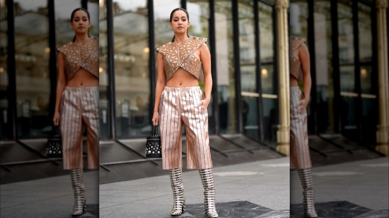 woman wearing crop top and metallic culottes