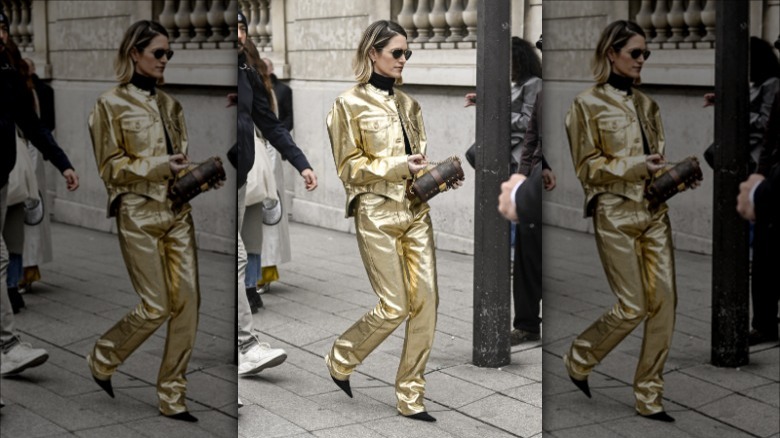 woman wearing gold metallic jacket and pants
