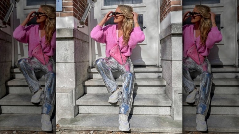 woman wearing pink cardigan and silver metallic pants