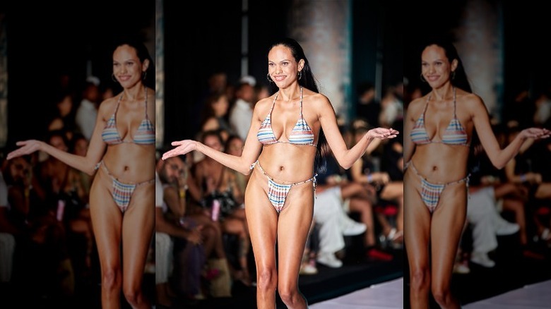 model walks the runway in bikini