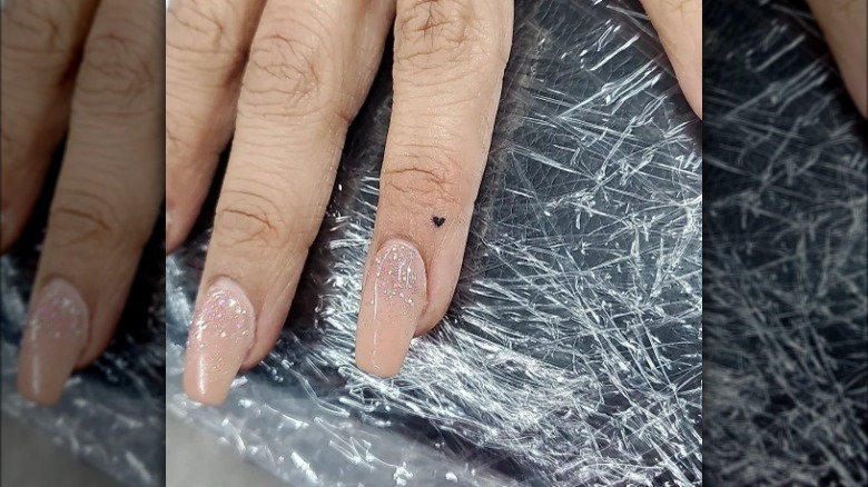 heart tattoo on a finger