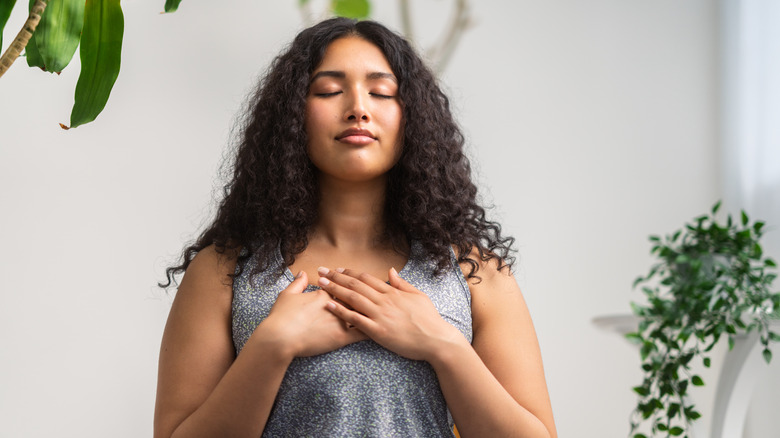 Woman takes deep breaths