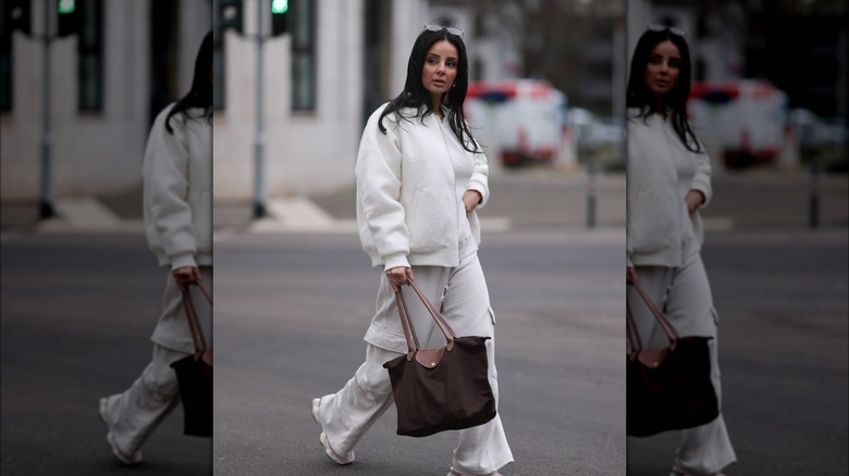 Woman holding shopper's bag