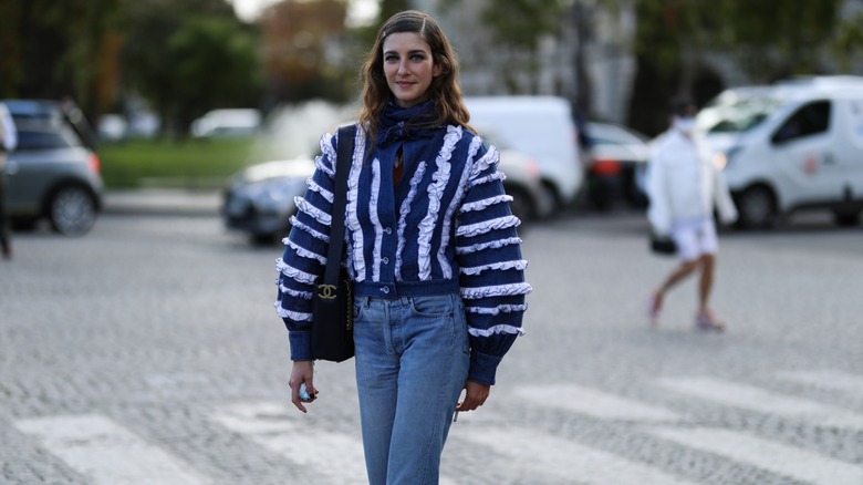 Woman wearing sweater with ruffles