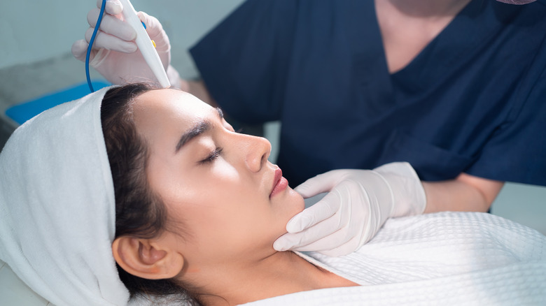 woman receiving microdermabrasion treatment