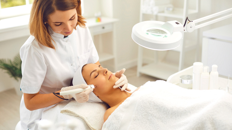 clinician giving microdermabrasion treatment