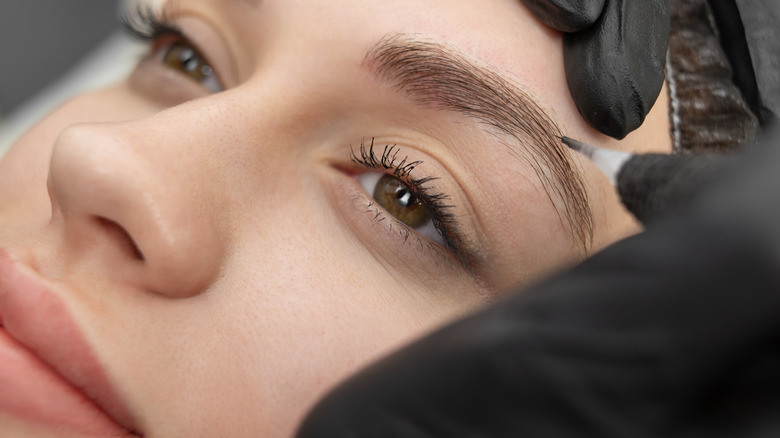 woman undergoing microfeathering procedure