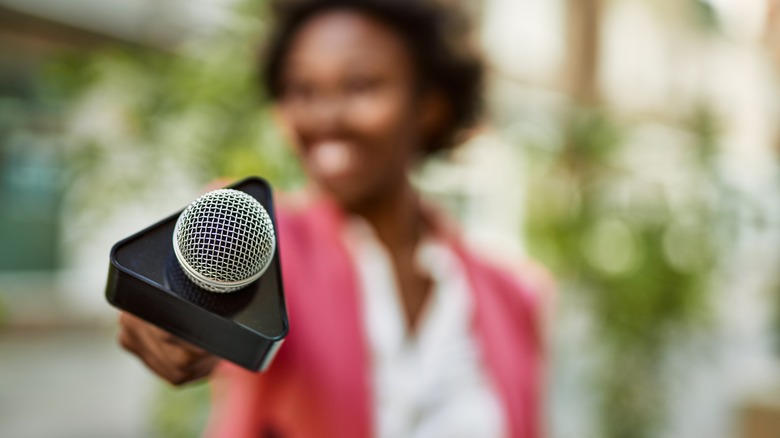 journalist holding mic