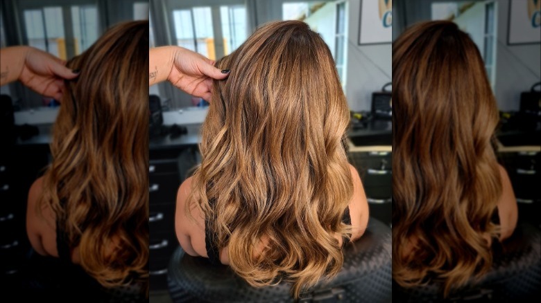 woman in salon chair with dyed hair