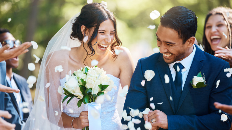 couple walking down aisle