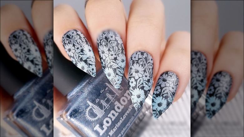 Woman with floral print nails