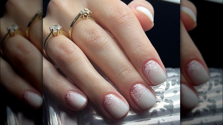 Milky white nails with glitter