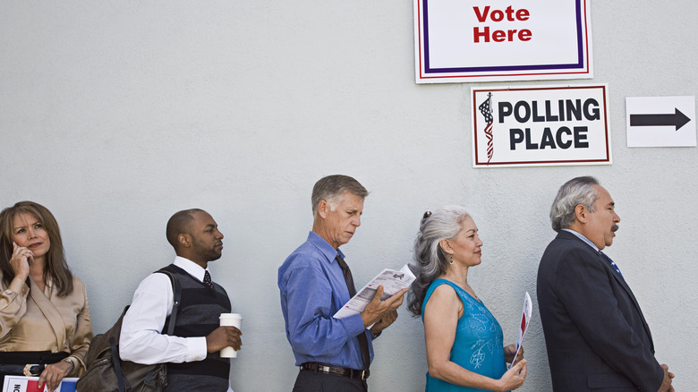 a line of adults voting