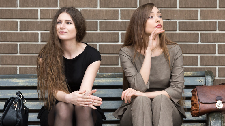 Two women holding a grudge 