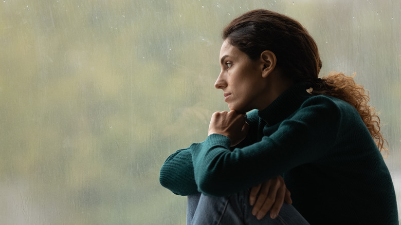 Woman staring at the rain