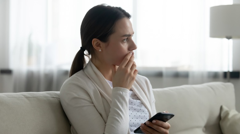 Anxious woman with a phone 