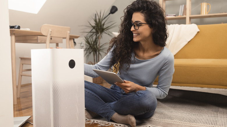 Woman setting up a new humidifier