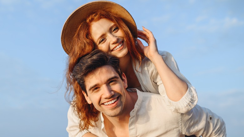 guy and woman smiling