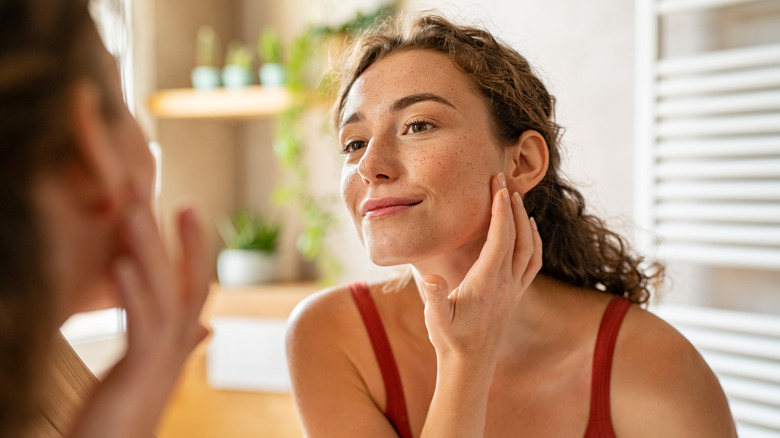 woman touching face