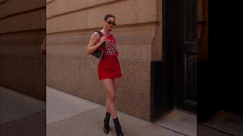 Girl wearing a jersey with a mini-skirt.