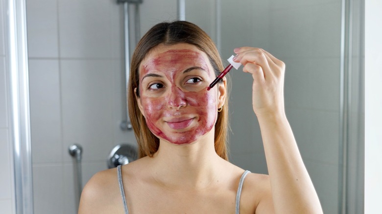 Woman using chemical exfoliator.