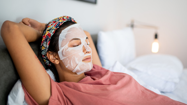 Sleeping woman wearing face mask