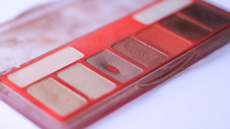 Red eyeshadow palette with one section used