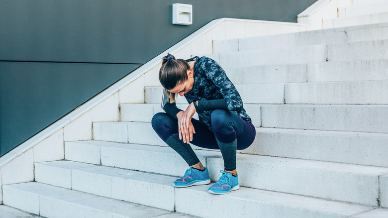 Woman sitting on steps