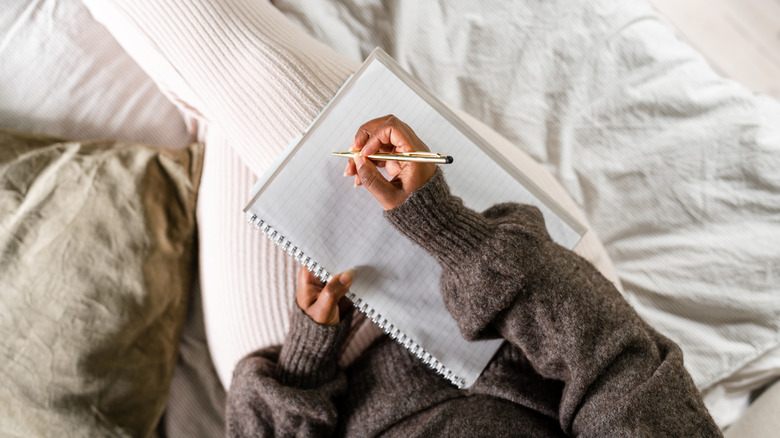 Woman with a blank notebook