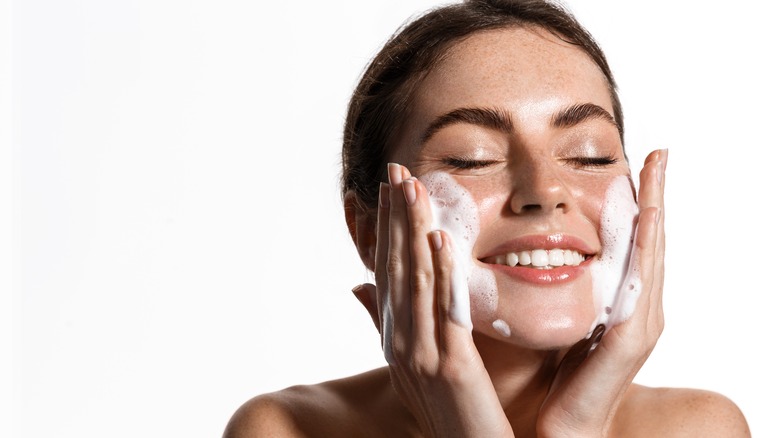 woman washing face