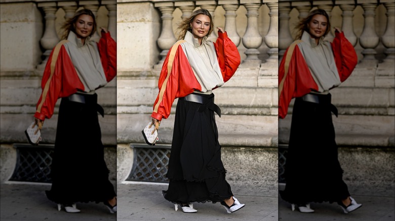 Woman wearing baggy jacket with maxi skirt