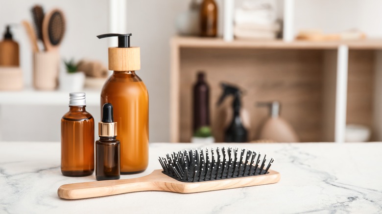 hair products on counter with brush 