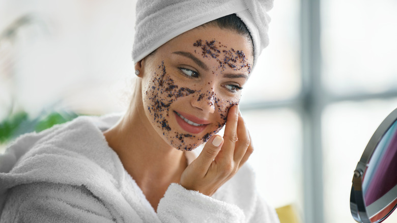 woman applying face scrub