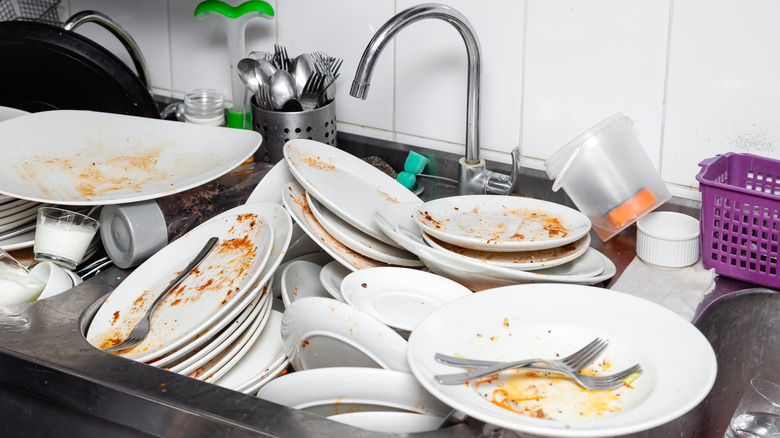 A sink overflowing with dishes