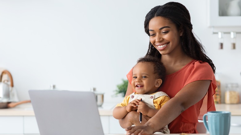 Mom with baby in front of laptop