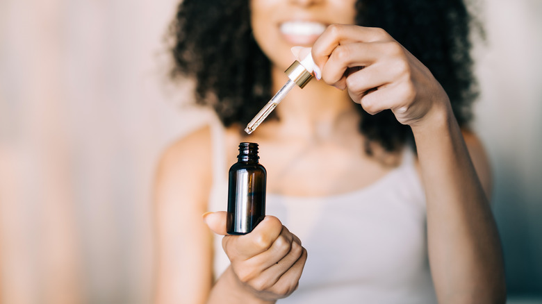 Woman using essential oils 