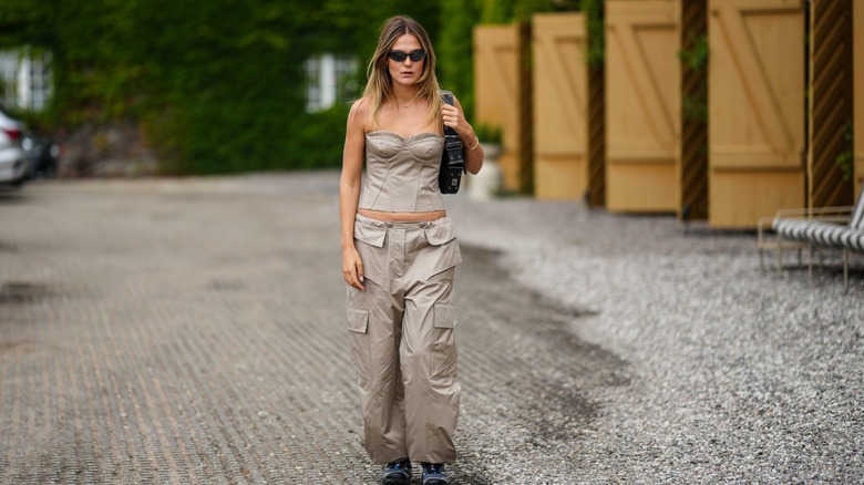 woman wearing bustier top and pants