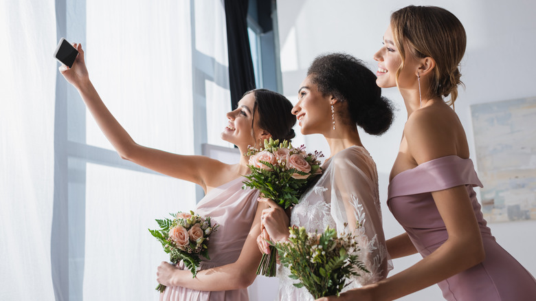 Bridesmaids taking a selfie 